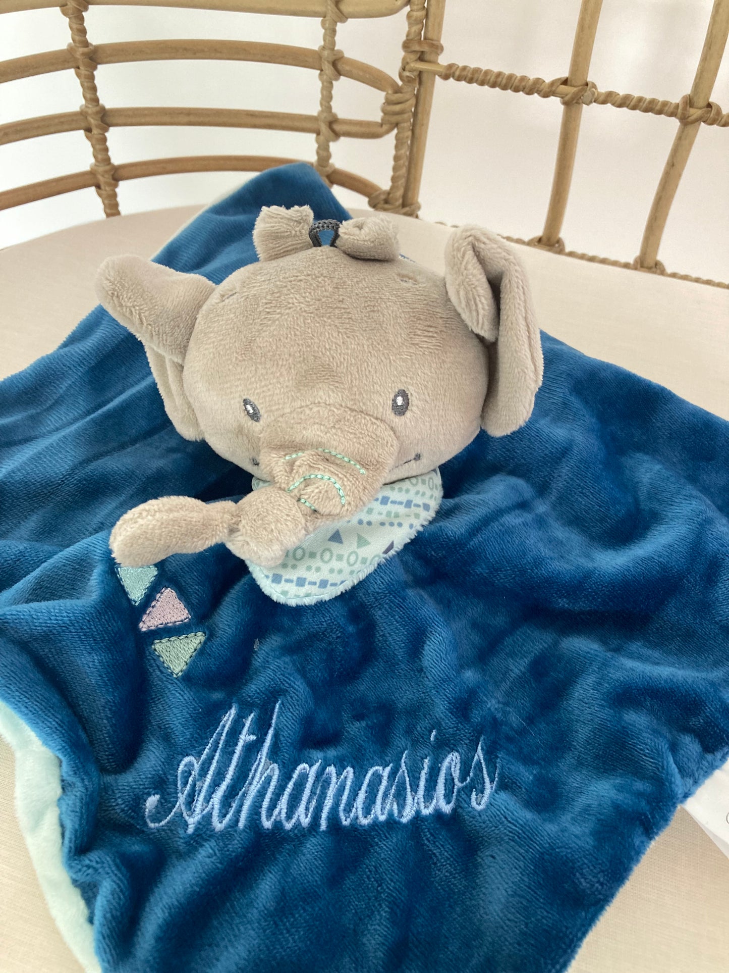 Personalized teal elephant baby comforter with the name 'Athanasios' embroidered on it.