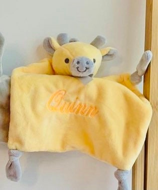 Yellow Giraffe baby comforter personalised with baby's name embroidered in yellow.