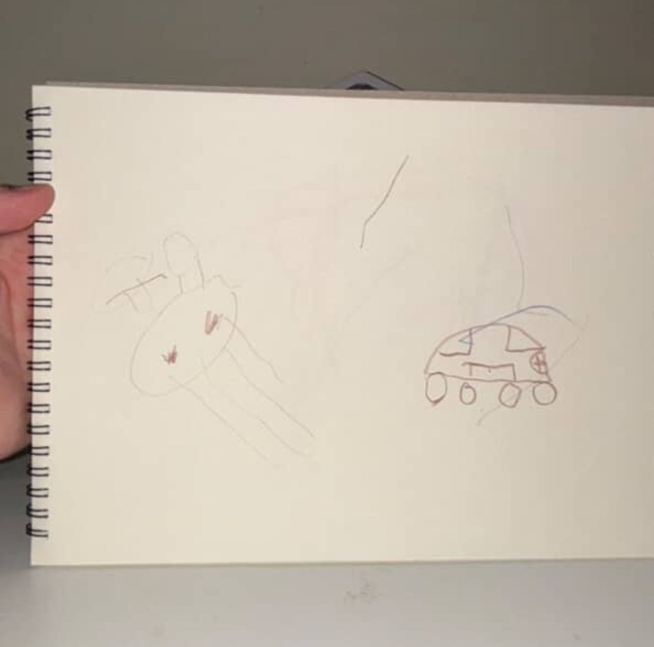 The unedited pictures of a child drawing that was sent to be converted into a knitted scarf.